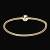 Charms armbånd i forgyldt bronze – Håndlavet smykke | Køb her »